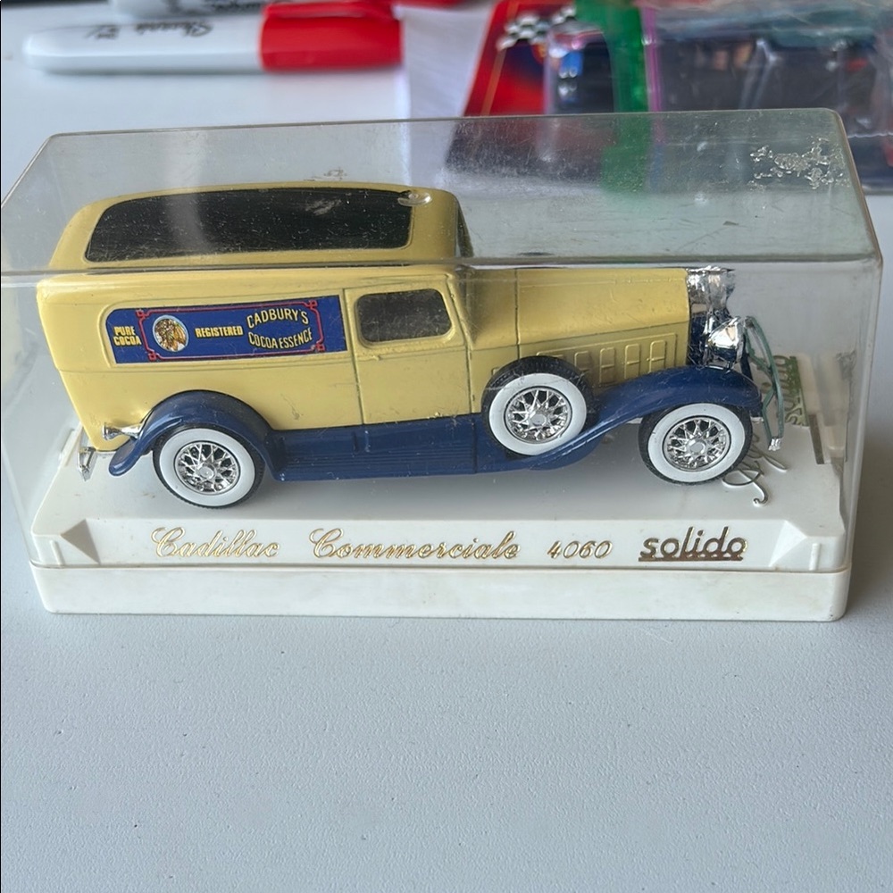 Solid Yellow and Blue Toy Car Model